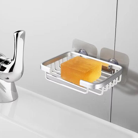 porte-savon mural avec savon jaune sur mur proche lavabo