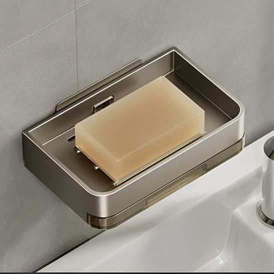 porte savon fixé au mur avec savon posé dans une salle de bain