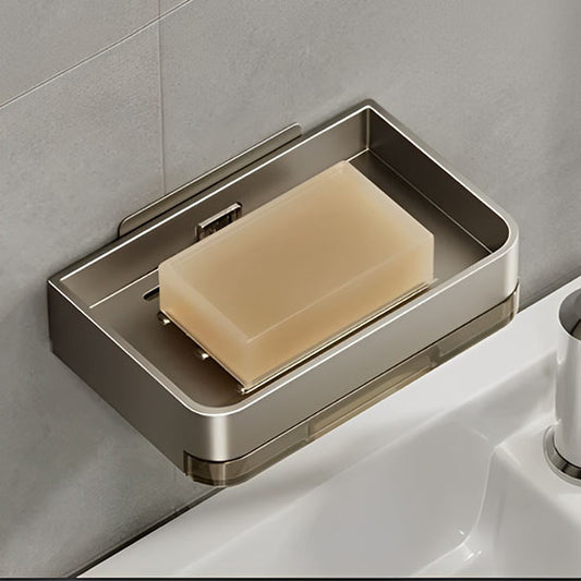 porte savon fixé au mur avec savon posé dans une salle de bain