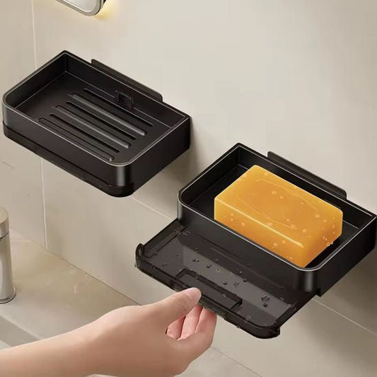 porte savon noir avec un savon jaune fixé facilement dans une salle de bain